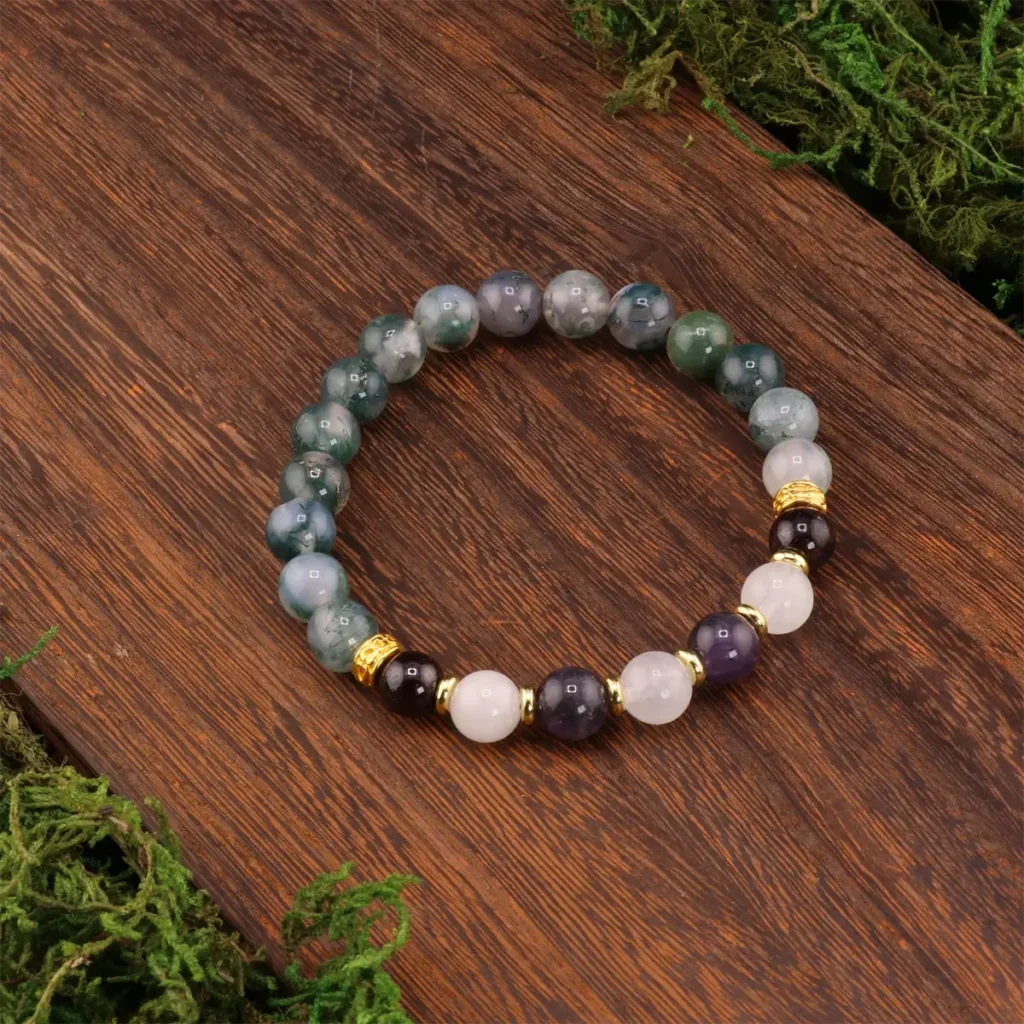 Aquarius meaning represented through a crystal bracelet with amethyst, aquamarine, and grounding stones