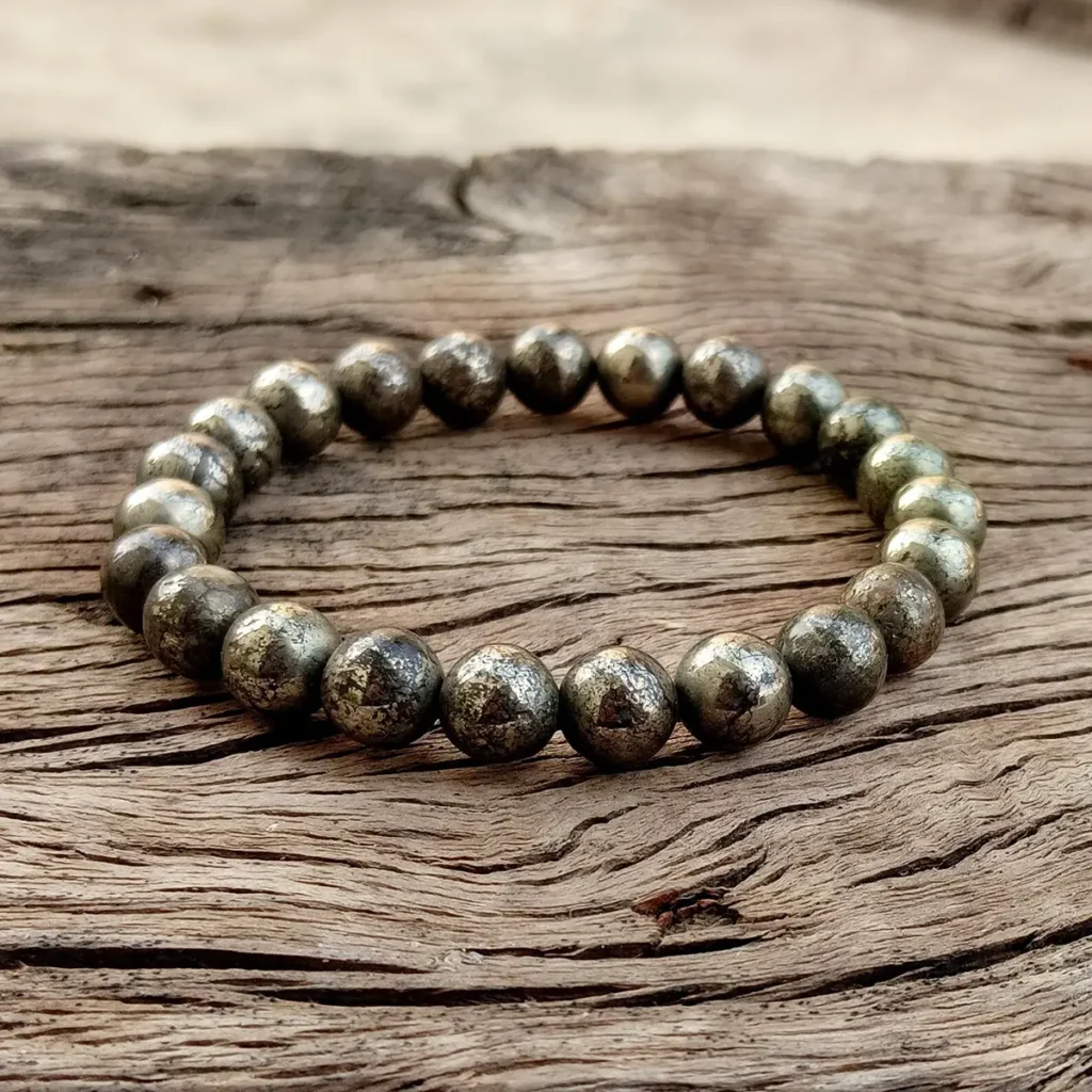 rooster zodiac meaning represented by pyrite crystal bracelet for confidence and protection