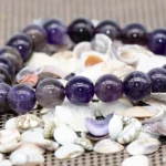 amethyst crystal bracelet on natural shell background