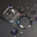 Aquarius birthstone bracelet displayed on a constellation card that lists traits like idealistic and inventive.