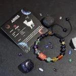 Aries birthstone bracelet displayed on a constellation card highlighting traits like courageous and energetic.