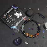 Capricorn birthstone bracelet presented on a constellation card with traits like ambitious and disciplined.