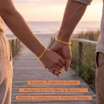 Couple holding hands at sunset on a boardwalk; text overlays advertise a gift set with a protective pouch and benefits like balance, confidence, and positive energy.