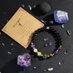 Virgo crystal bracelet surrounded by raw healing stones like Amethyst and Lapis Lazuli.