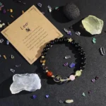 leo crystal bracelet flat lay with natural crystals and stones