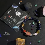 Leo birthstone bracelet displayed on an astrology card highlighting traits like confident and generous.