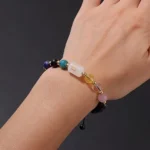 Close-up of a libra birthstone bracelet featuring Lapis Lazuli and Rose Quartz beads on a wrist.