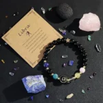 libra crystal bracelet flat lay with raw crystals and natural stone aesthetic background