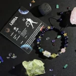 Libra birthstone bracelet displayed on a kraft paper card highlighting traits like diplomatic and artistic.