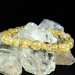 natural citrine bracelet on raw crystal stone background