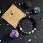 pisces crystal bracelet flat lay with amethyst rose quartz fluorite natural crystal background