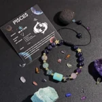 Pisces birthstone bracelet presented on a kraft paper card highlighting traits like imaginative and empathetic.