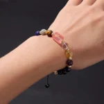 Close-up of a sagittarius birthstone bracelet featuring sky blue Turquoise and deep indigo Sodalite beads on a wrist.