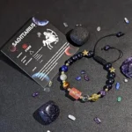 Sagittarius birthstone bracelet presented on a kraft paper card with traits like adventurous and optimistic.