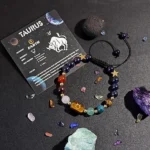 Taurus birthstone bracelet displayed on a kraft paper card highlighting traits like patient and reliable.