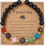 Taurus crystal bracelet displayed on a kraft paper card describing the Venus-ruled zodiac traits.