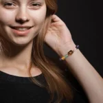 Full view of the virgo birthstone bracelet on a dark background showing the complete bead sequence.