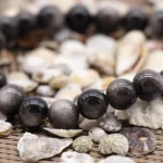 black obsidian bracelet men polished beads close up detail
