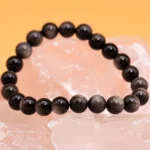 black obsidian bracelet men 8mm beads on crystal background