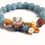 blue lucky charm bracelet for women with bead design and cat pendant