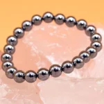hematite stone bracelet 8mm beads on crystal display