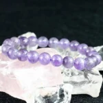 lavender amethyst bracelet 8mm beads on crystal background