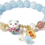 light blue bead bracelet close up with cat charm and bead details