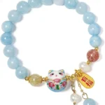 light blue bead bracelet with lucky cat charm and smooth round beads
