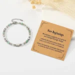 new beginnings crystal bracelet for women flat lay with meaning card