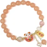 orange lucky charm bracelet full circle view with smooth bead design