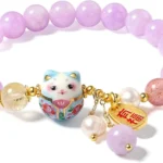 purple lucky charm bracelet close up with bead and charm details