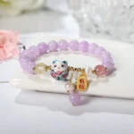 purple lucky charm bracelet with floral background aesthetic jewelry