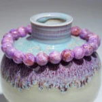 purple turquoise bracelet 8mm beads on ceramic background