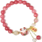 red lucky charm bracelet full view with smooth bead arrangement