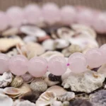rose quartz bead bracelet pink beads close up texture