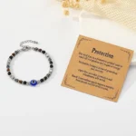 spiritual protection bracelet for women flat lay evil eye bracelet with meaning card