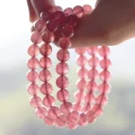 strawberry quartz bracelet stacked multiple bracelets on wrist