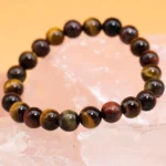 tiger eye stone bracelet 8mm beads on crystal background