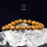 wood grain jasper bracelet brown beads on crystal background