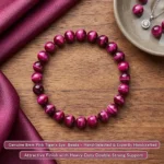 natural pink tiger eye bracelet for women displayed on wooden table