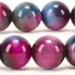 Colorful glossy bead bracelet made of round marbles in purple, blue, and pink tones.